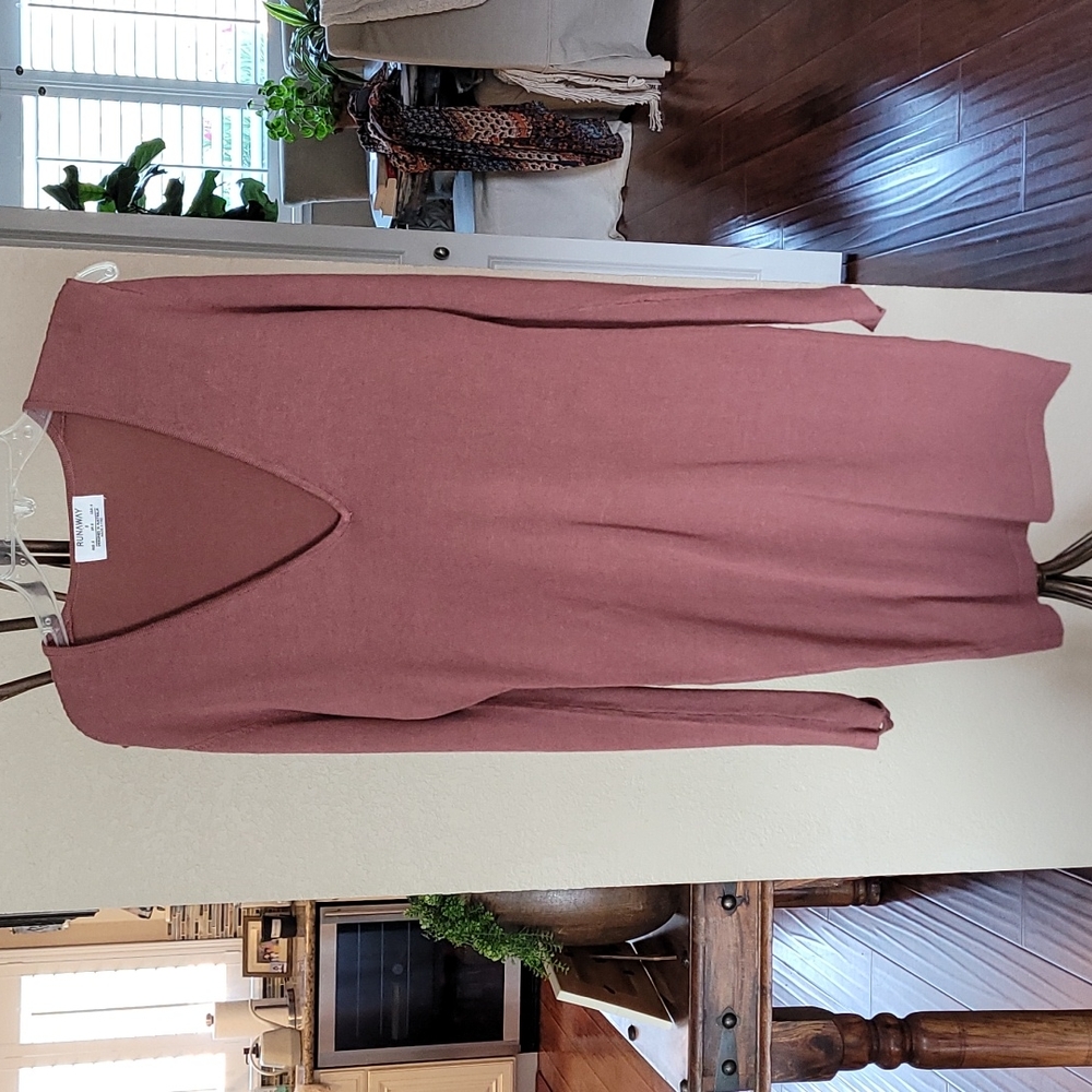Runaway sweater dress with open slits on sleeves.